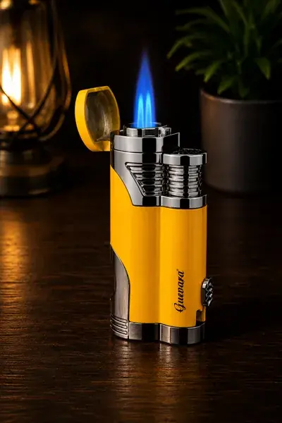 A metal double-jet torch lighter standing upright, fuel window visible on its side