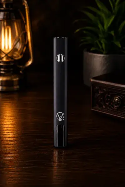 A matte black cylindrical battery upright beside its USB-C charging cable